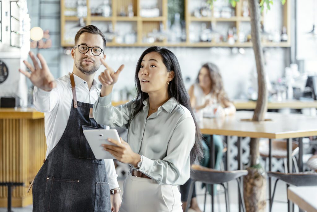 Waiter and Manager in a Coffee Shop