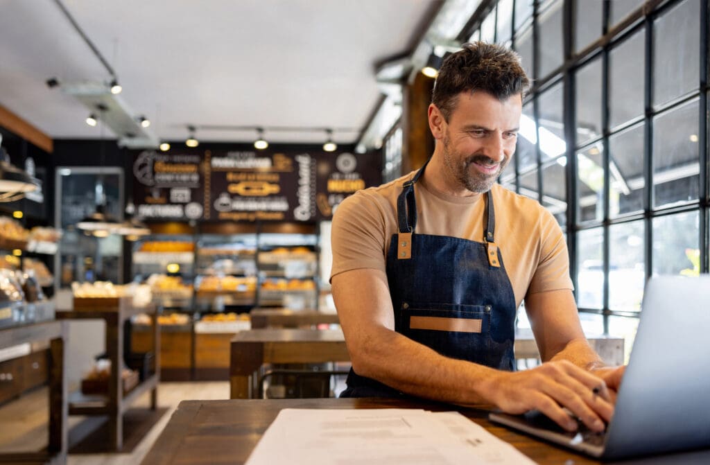 Business owner doing the accountancy while working at a coffee shop